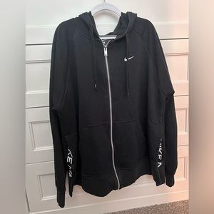 Black nike zip-up with slits on the sides